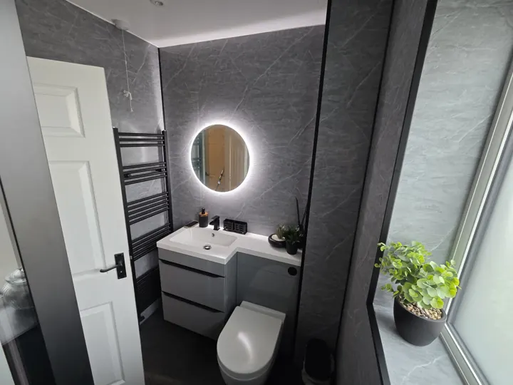 Completed bathroom interior with freestanding bath